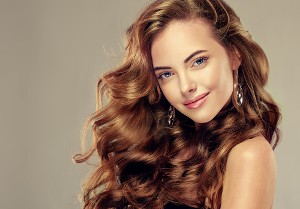 Woman With Brown Large Curls | Hair Color Services in Northridge, CA